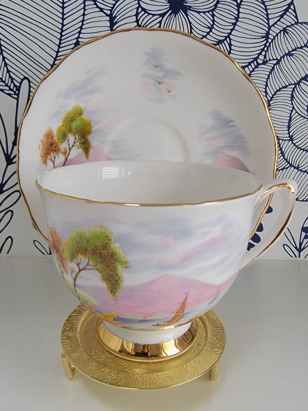 Colclough of Ridgeway Potteries Ltd. teacup & saucer, sunset trees sailing pink